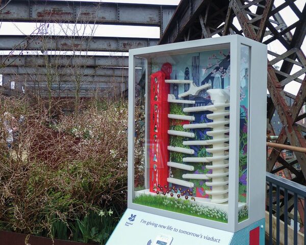 A display case in the garden on Castlefield Viaduct