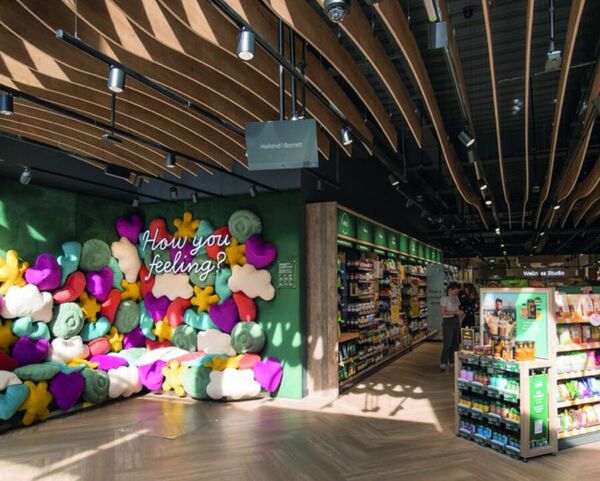 A wall of fabric flowers in the Holland & Barrett Experience Store, Cardiff