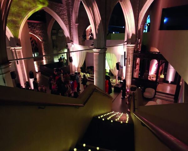 Lit arches at The Garden Museum for Pandora