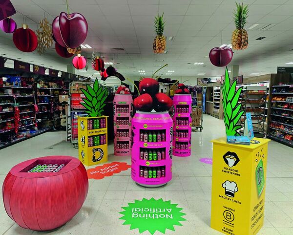 Giant fruit and Dalstons Soda displays in a Waitrose store
